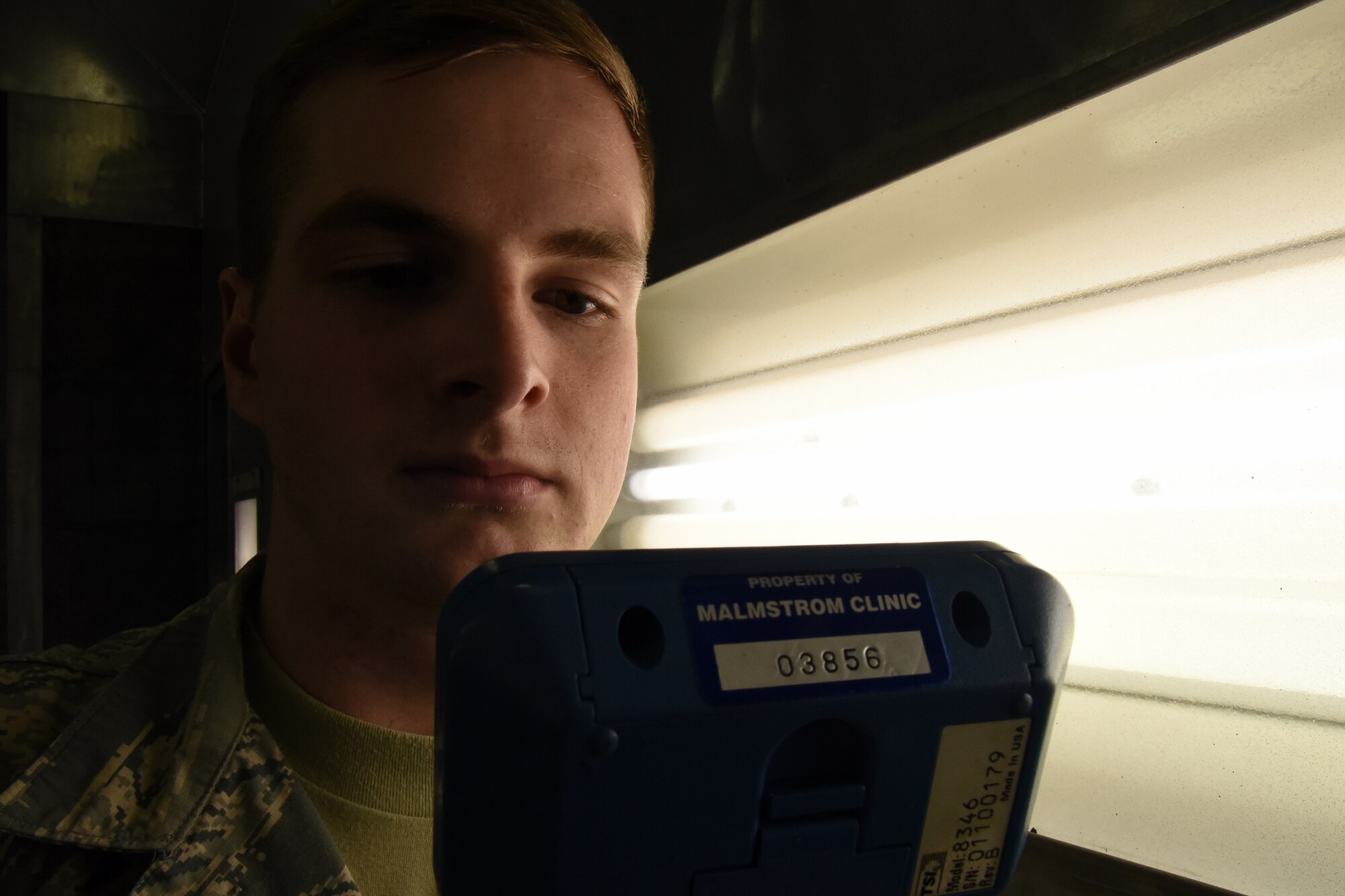 Airman 1st Class William Raetz, 341st Medical Operations Squadron bioenvironmental engineering technician, performs a ventilation survey inside a paint booth at the Auto Hobby shop April 8, 2015, Malmstrom Air Force Base, Mont. Bioenvironmental routinely monitor 66 ventilation systems across the base to ensure safe working conditions. (U.S. Air Force photo/Chris Willis)