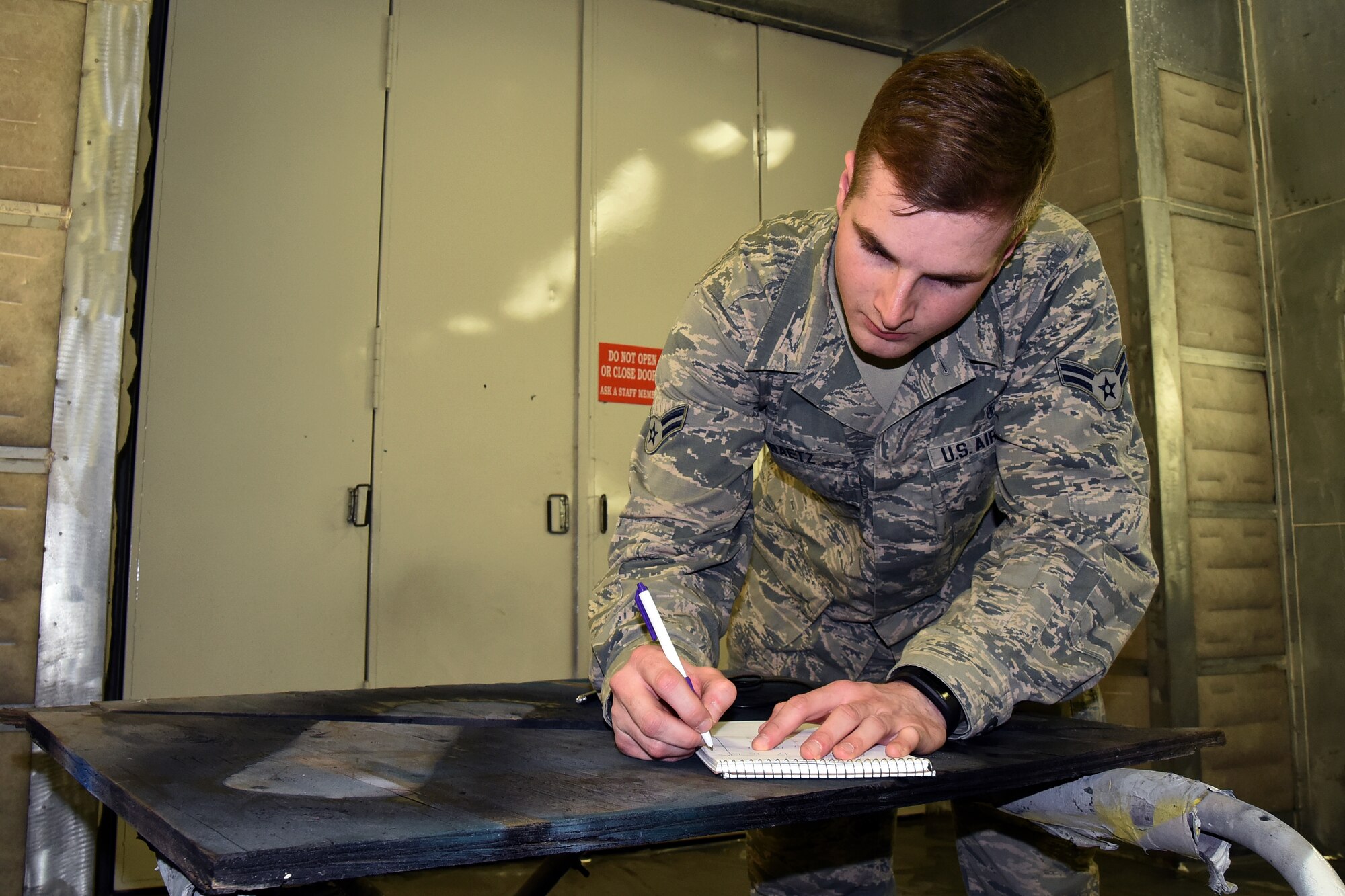 Airman 1st Class William Raetz, 341st Medical Operations Squadron bioenvironmental engineering technician, performs a ventilation survey inside a paint booth at the Auto Hobby shop April 8, 2015, Malmstrom Air Force Base, Mont. Bioenvironmental routinely monitor 66 ventilation systems across the base to ensure safe working conditions. (U.S. Air Force photo/Chris Willis)