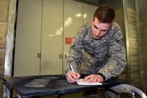 Airman 1st Class William Raetz, 341st Medical Operations Squadron bioenvironmental engineering technician, performs a ventilation survey inside a paint booth at the Auto Hobby shop April 8, 2015, Malmstrom Air Force Base, Mont. Bioenvironmental routinely monitor 66 ventilation systems across the base to ensure safe working conditions. (U.S. Air Force photo/Chris Willis)