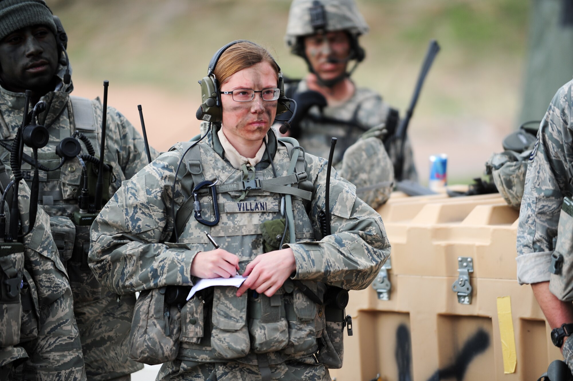 Air Force Reserve Staff Sgt. Nicolina Villani-Martinez writes down critical information as she receives an operations order for the day’s simulated mission prior to heading out April 9, 2015, at the U.S. Air Force Academy in Colorado Springs, Colo. The 710th and 310th Security Forces Squadrons held a joint combat leaders course while living in field conditions. The 710th SFS is out of Buckley Air Force Base, Colo., and the 310th is out of Schriever AFB.
(U.S. Air Force photo/Tech. Sgt. Nicholas B. Ontiveros)