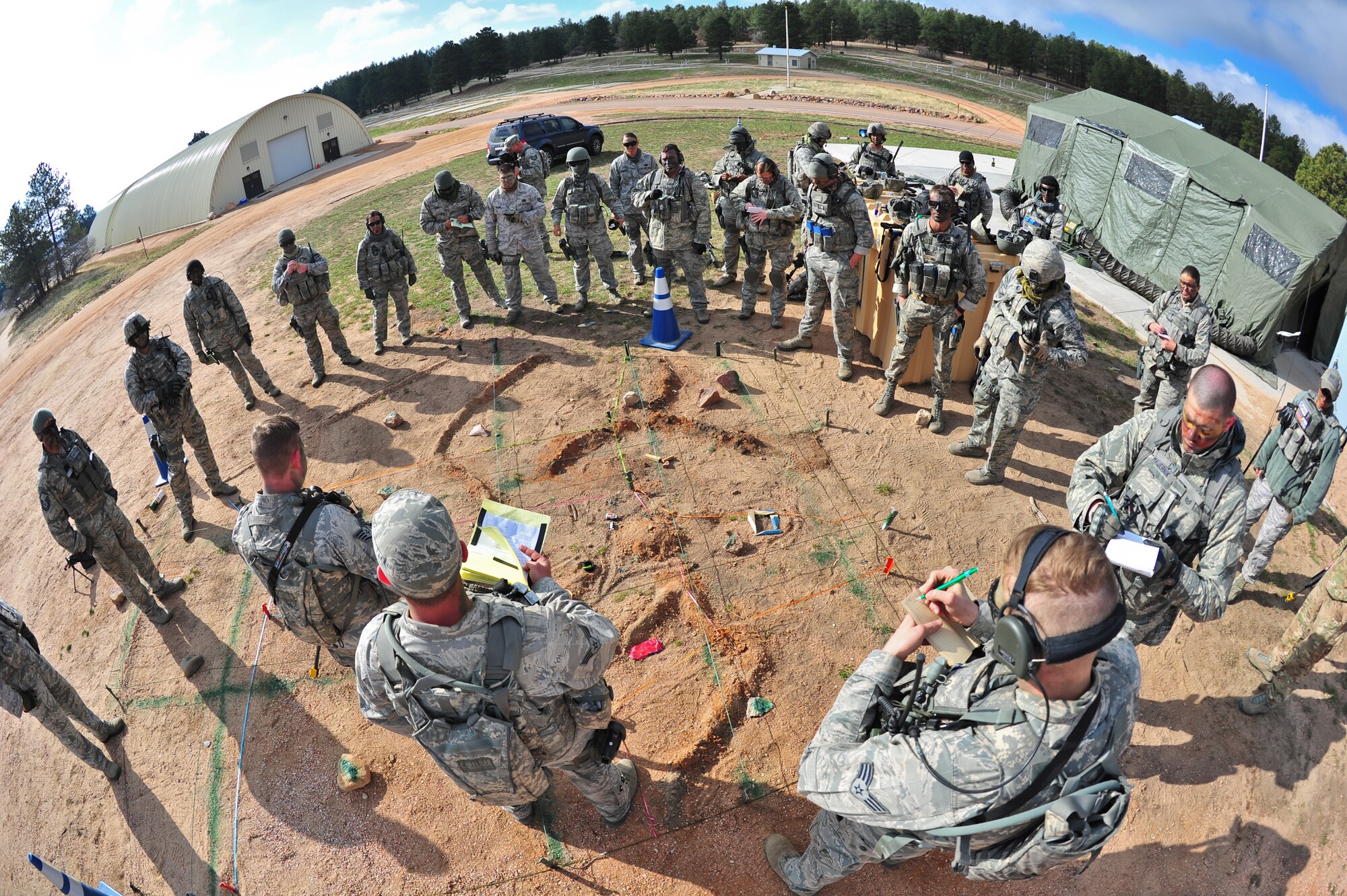 Air Force Reservists from the 710th and 310th Security Forces Squadrons based out of Colo., receive an operations order for the day’s simulated mission prior to heading out April 9, 2015, at the U.S. Air Force Academy in Colorado Springs, Colo. The 710th and 310th Security Forces Squadrons held a joint combat leaders course while living in field conditions. The 710th SFS is out of Buckley Air Force Base, Colo., and the 310th is out of Schriever AFB.
(U.S. Air Force photo/Tech. Sgt. Nicholas B. Ontiveros)