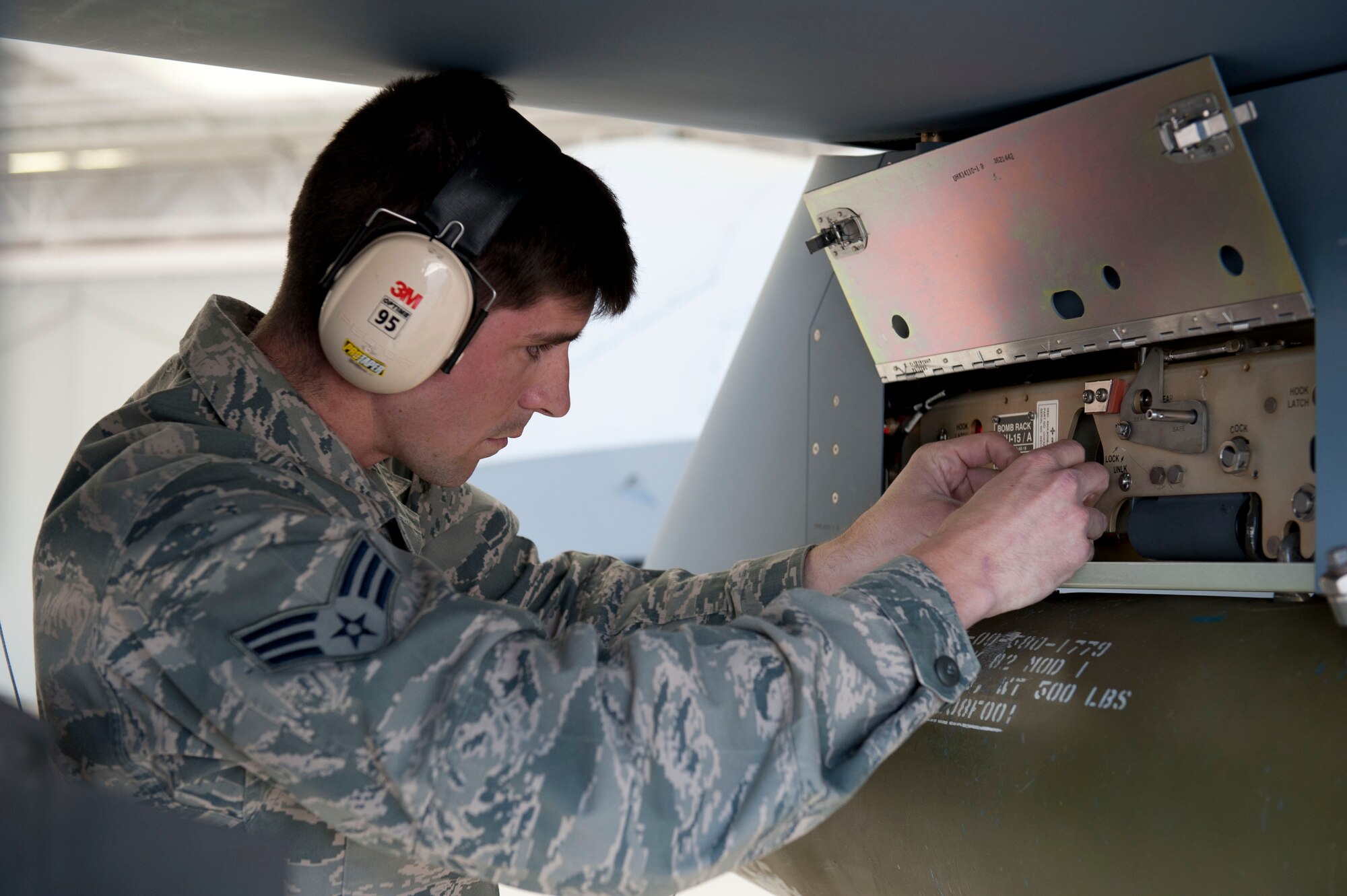 Senior Airman Thomas Lahut, 49th Aircraft Maintenance Squadron, a member of weapon load crew 53, does a final inspection on the loading of a AGM-114 Hellfire during a weapons load competition at Holloman Air Force Base, N.M. April 10, 2015. For the competition, points are awarded for weapons-loading, toolkit inspection, and uniform inspection. (U.S. Air Force photo by Staff Sgt. E’Lysia A. Wray/Released)