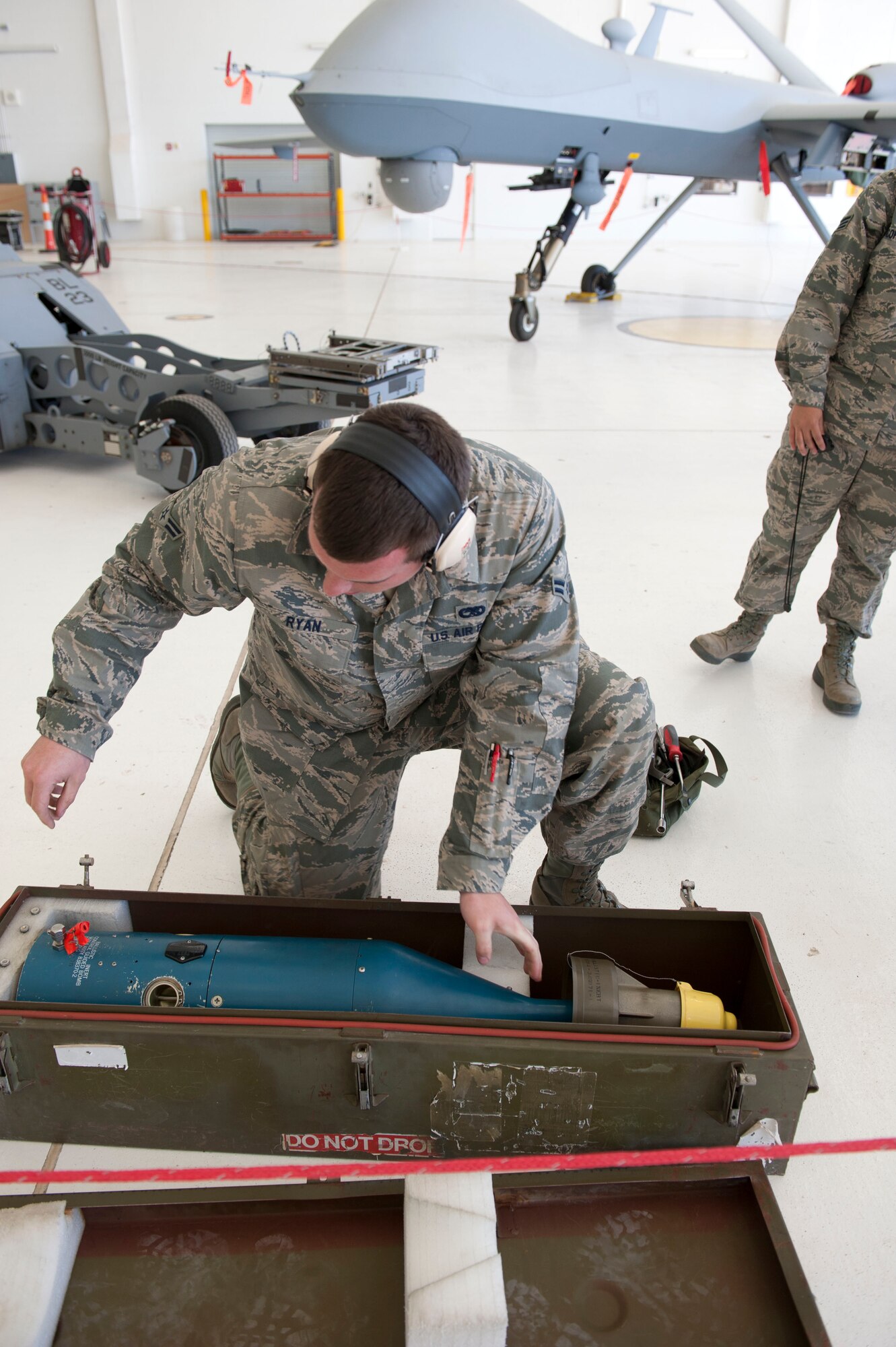 Airman 1st Class Christopher Ryan, 49th Aircraft Maintenance Squadron, a member of weapon load crew 53, inspects a GBU-12 Paveway II during a weapons load competition at Holloman Air Force Base, N.M. April 10, 2015. A GBU-12 Paveway II is a laser-guided bomb based on MK 82 500-pound general purpose bomb. For the competition, points are awarded for weapons-loading, toolkit inspection, and uniform inspection. (U.S. Air Force photo by Staff Sgt. E’Lysia A. Wray/Released)