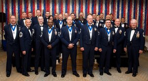 Joint Base Charleston Chiefs pose for a group photo with newly promoted chiefs and chief selects April 11, 2015, at the Charleston Club on Joint Base Charleston, S.C. The intent of the ceremony is to honor the chief master sergeants and their families for achieving this impressive milestone in their careers. (U.S. Air Force photo/Airman 1st Class Clayton Cupit)
