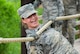 A United States Air Force basic trainee attempts to keep her balance on the cable crossing obstacle at the Basic Expeditionary Airman Skills Training site at Joint Base San Antonio-Lackland, Texas, April 8, 2015. Known as the 
