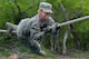 A United States Air Force basic trainee crosses the Horizontal Rope obstacle at the Basic Expeditionary Airman Skills Training site at Joint Base San Antonio-Lackland, Texas, April 8, 2015. Known as the 
