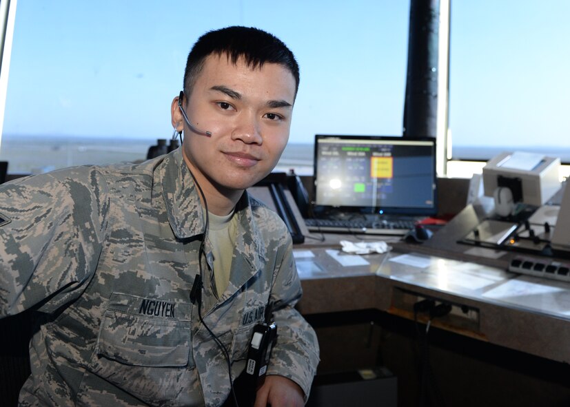 ALTUS AIR FORCE BASE, Okla. – U.S. Air Force Airman 1st Class Tuan Nguyen, 97th Operations Support Squadron air traffic controller, pauses during his shift in the control tower, April 9, 2015. Nguyen recently received his acceptance letter in to the U.S. Air Force Academy, and will begin his education July 2015. (U.S. Air Force photo by Airman 1st Class Nathan Clark/Released)
