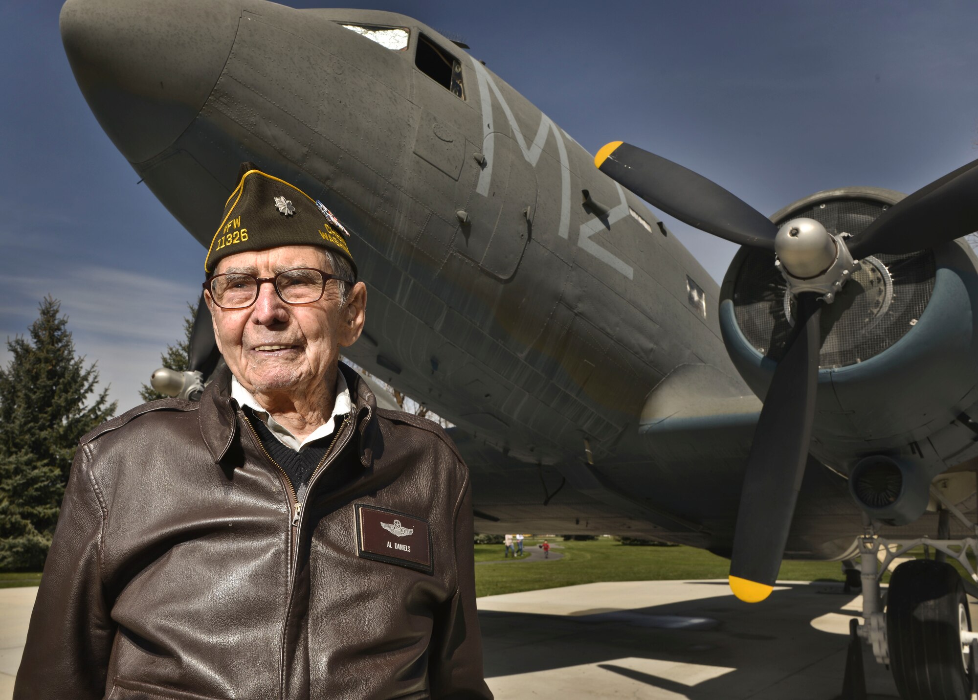 Retired U.S. Air Force Lt. Col. Alston Daniels stands proudly outside of a C-47D Skytrain on static display at Fairchild AFB, Wash. April 7, 2015. Daniels flew the C-47 during World War II and calls it his favorite plane of the 10 he flew throughout his career. (U.S. Air Force photo/Staff Sgt. Alex Montes)