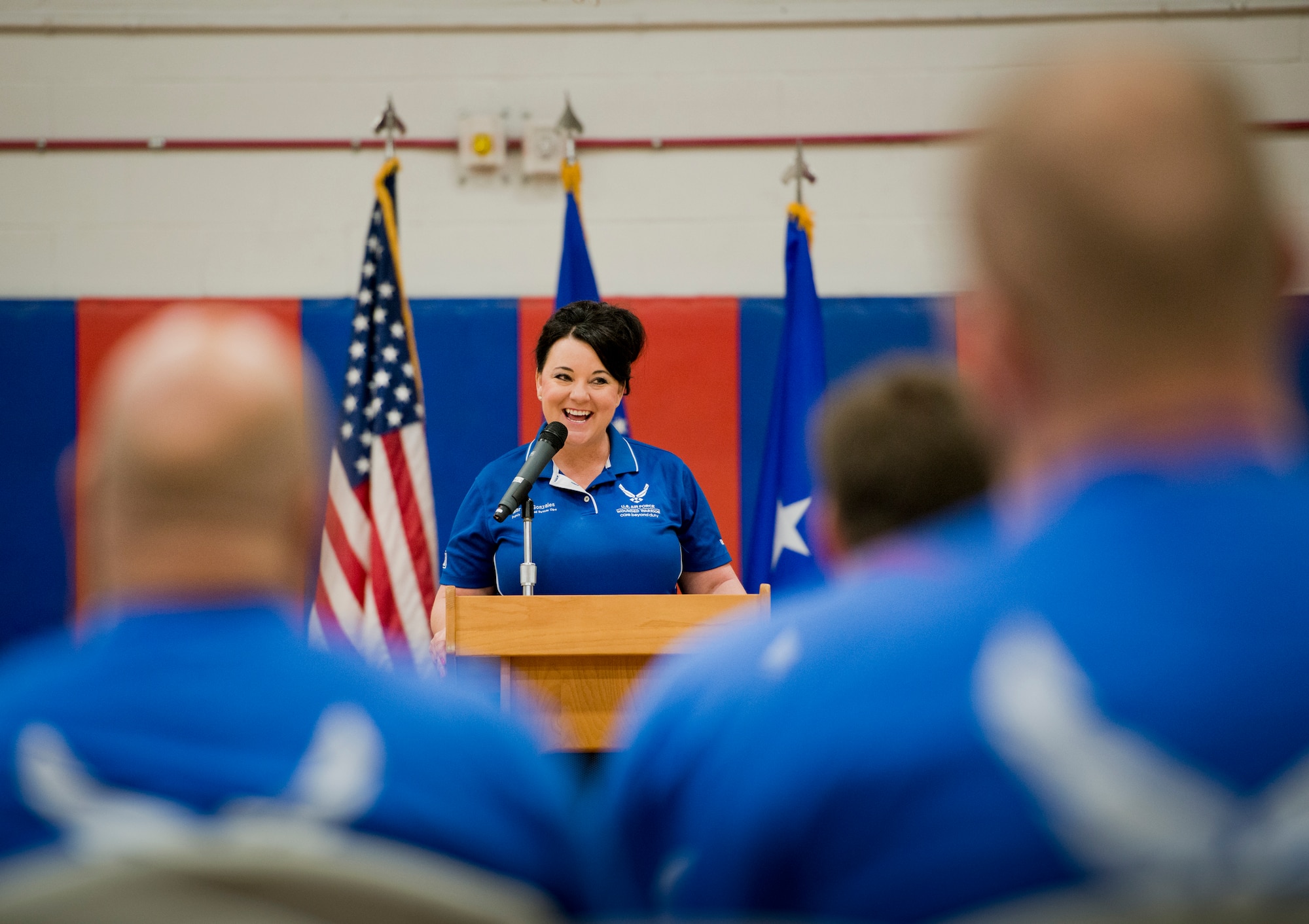 Marsha Gonzales speaks to the more than 50 athletes and mentors at the opening ceremony of the Air Force introductory adaptive sports and rehabilitation camp at Eglin Air Force Base, Fla., April 13. The DOD’s military adaptive sports program enhances warrior recovery by engaging wounded, ill and injured service members in ongoing, daily adaptive activities, based on their interest and ability. This is the first event of the type to be held at Eglin. (U.S. Air Force photo/Samuel King Jr.)