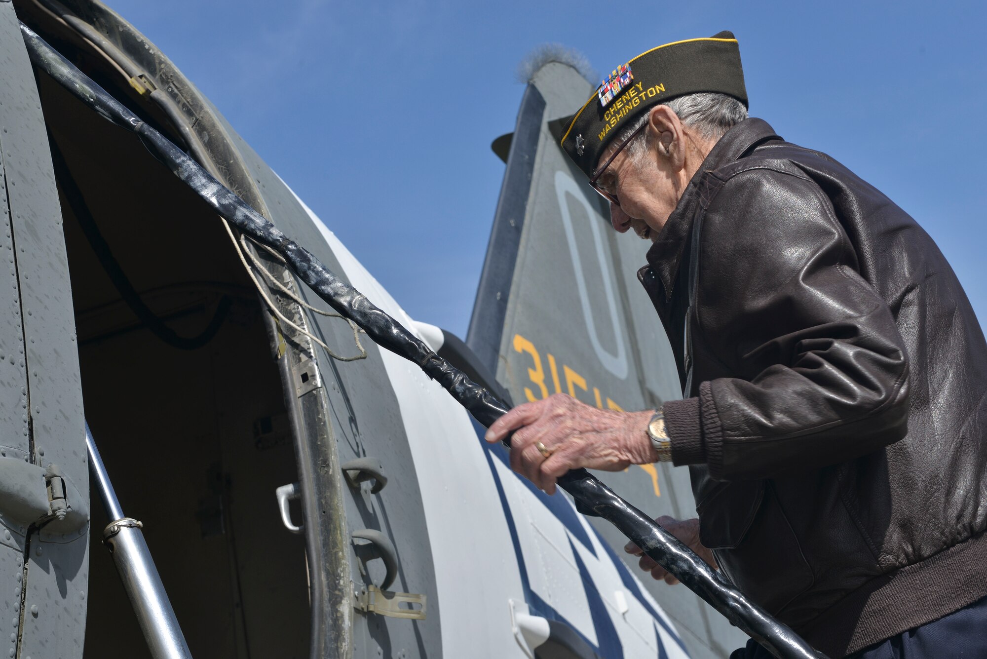Retired U.S. Air Force Lt. Col. Alston Daniels climbs into a C-47D Skytrain aircraft for the first time in 53 years April 7, 2015, at Fairchild AFB, Wash. Daniels flew the C-47 during World War II and had the chance to visit the aircraft while it is on static display. (U.S. Air Force photo/Staff Sgt. Alex Montes)