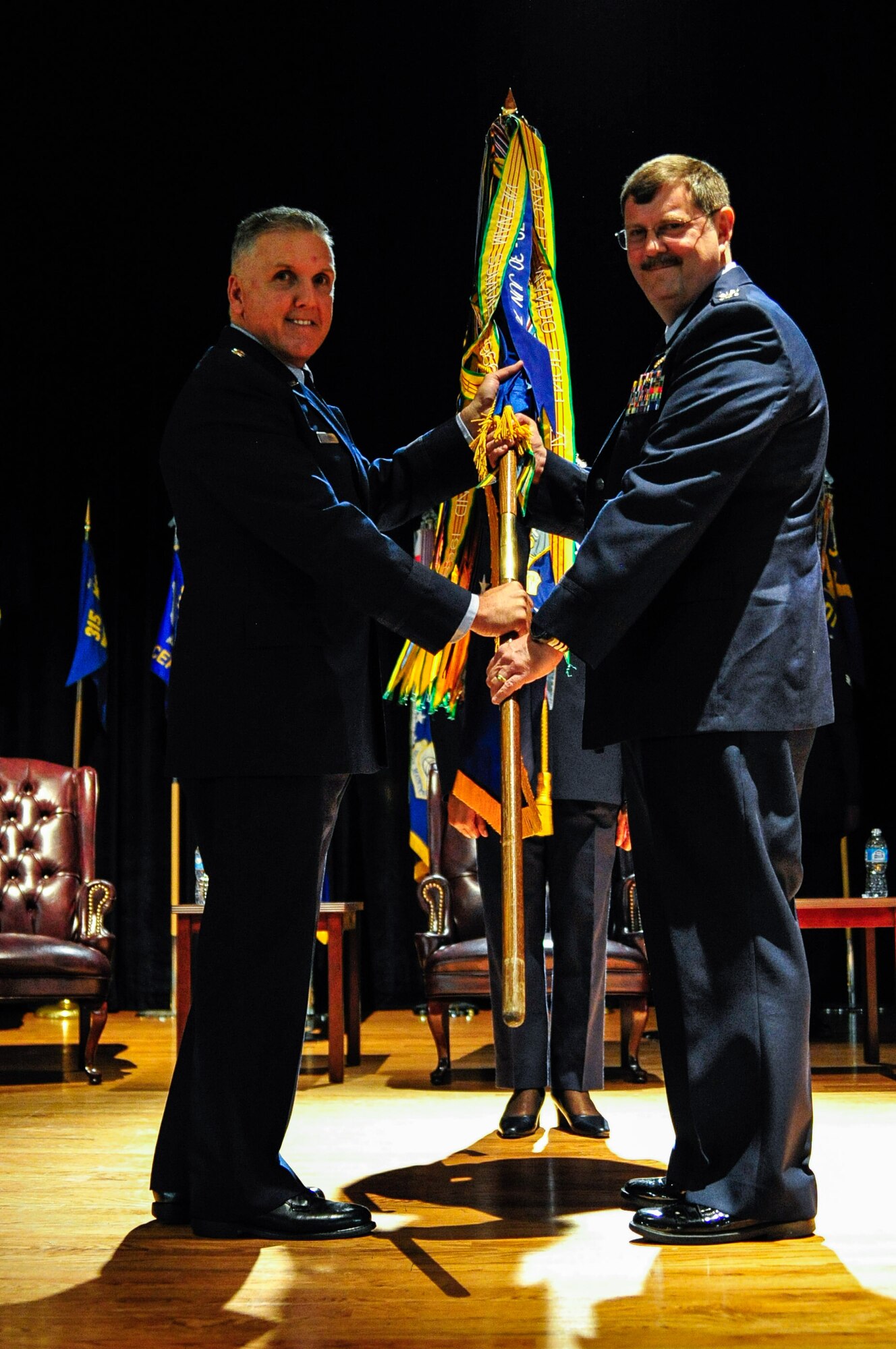 Maj. Gen. John C. Flournoy and Col. Greg Gilmour pose for a picture during the 315th Airlift Wing change of command ceremony March 11, 2015 at the Joint Base Charleston theater. Flournoy, 4th Air Force commander, presided over the ceremony where Col. Greg Gilmour assumed command of the 315th AW from Col. James Fontanella. Gilmour was previously the commander of the 916th Air Refueling Wing at Seymour Johnson Air Force Base in North Carolina, and Fontanella, outgoing commander, is headed  to Robins Air Force Base, Georgia as the commander of the Air Force Reserve Force Generation Center. (U.S. Air Force Photo by Staff Sgt. Bobby Pilch)