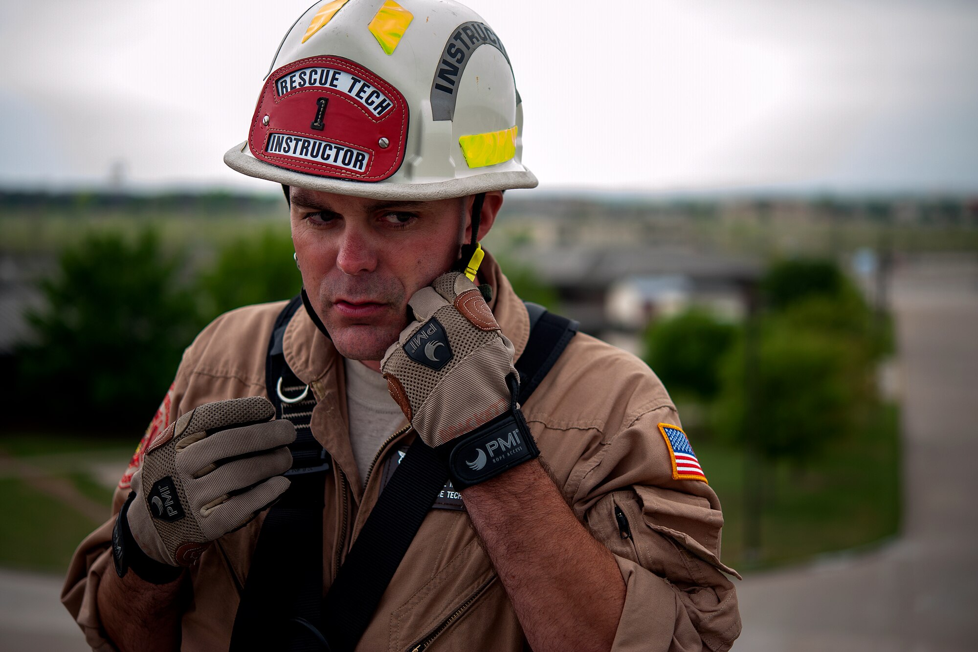 GOODFELLOW AIR FORCE BASE, Texas – Tech. Sgt. Aaron C. Brackett, 312th Training Squadron rescue course NCO in charge, adjusts his hard hat’s chin strap before rappelling at the Louis F. Garland Department of Defense Fire Academy April 8. Brackett and his students assess safety precautions before conducting any training at the fire academy. (U.S. Air force photo/ Airman 1st Class Devin Boyer)
