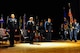 The 315th Airlift Wing change of command ceremony gets underway at the Joint Base Charleston theater March 11, 2015.  Maj. Gen. John C. Flournoy, Jr., commander 4th Air Force, presided over the ceremony where Col. Greg Gilmour assumed command of the 315th AW from Col. James Fontanella. Gilmour was previously the commander of the 916th Air Refueling Wing at Seymour Johnson Air Force Base in North Carolina, and Fontanella, outgoing commander, is headed  to Robins Air Force Base, Georgia as the commander of the Air Force Reserve Force Generation Center. (U.S. Air Force Photo by Staff Sgt. Bobby Pilch)