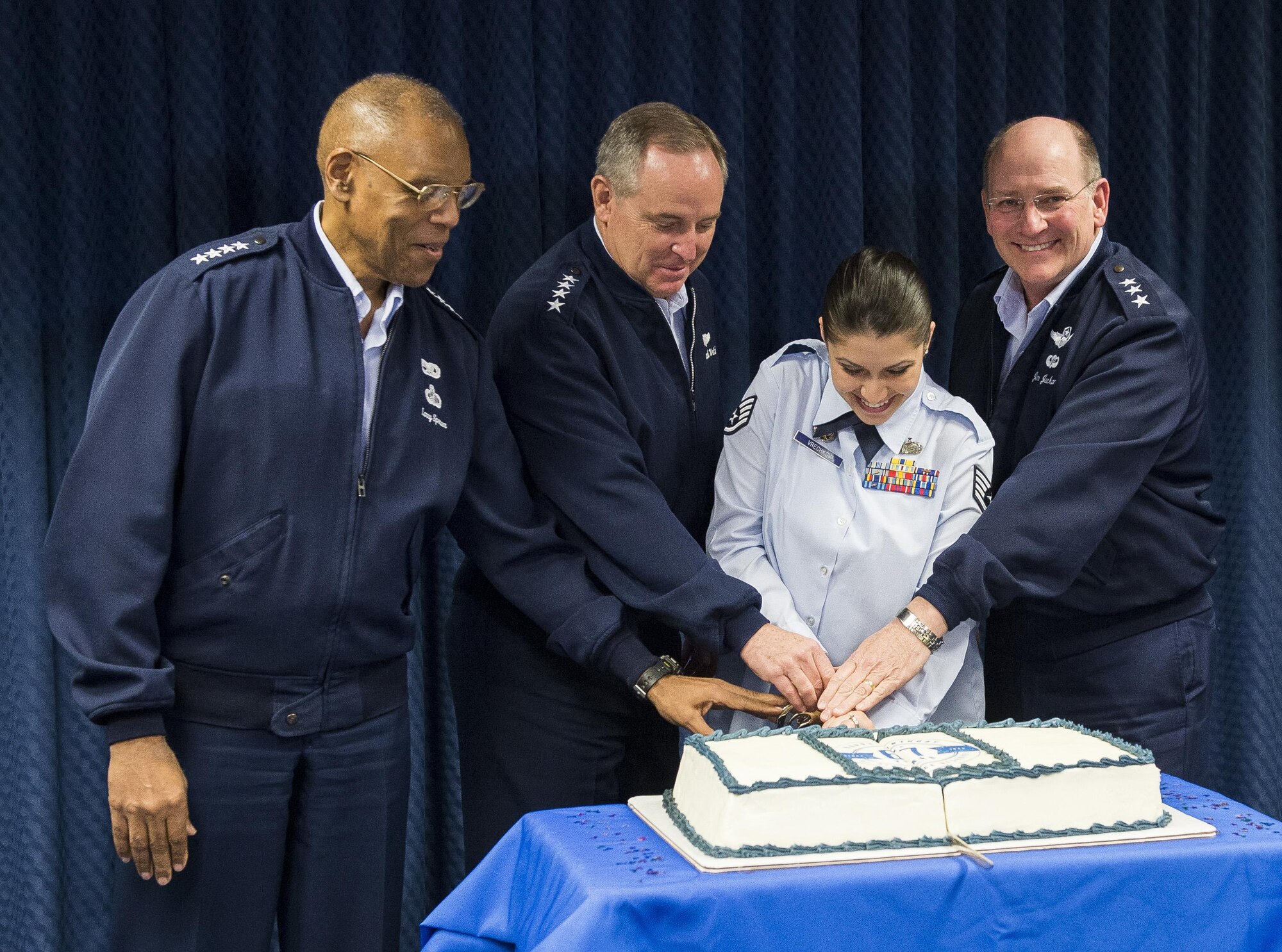 Air Force Chief of Staff Gen. Mark A. Welsh III (second from left), the junior most ranking member of Reserve Affairs (RA) staff, Staff Sgt. Ivanka Vrechkov (third from left), Vice Chief of Staff Gen. Larry Spencer (left) and Chief of the Air Force Reserves Lt. Gen. James Jackson (right) cut a cake celebrating the Air Force Reserves 67th birthday during a ceremony in the Pentagon, April 6, 2015, Washington, D.C. Vrechkov is the Non-Commissioned Officer in Charge of Policy Integration for RA. The reserves were established on April 14, 1948 by President Harry S. Truman, seven months after the active duty Air Force was established as a separate service. Originally the reserves were a standby force for use in wartime and national emergencies. The Air Force Reserves became a Major Command (MAJCOM) in 1973 and began working side-by-side with their active duty counterparts. The reserves also perform unique missions such as pararescue and weather reconnaissance. (U.S.Air Force photo/Jim Varhegyi) 
