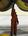 Senior Airman Seth Root, 5th Maintenance Squadron crew chief, does maintenance on a B-52H Stratofortress on Minot Air Force Base, N.D., April 8, 2015. Members of the 5th MXS provide routine maintenance on a B-52H Stratofortress. (U.S. Air Force photo/Senior Airman Kristoffer Kaubisch)