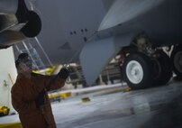 Senior Airman Seth Root, 5th Maintenance Squadron crew chief, washes the wing of a B-52H Stratofortress on Minot Air Force Base, N.D., April 8, 2015. The B-52s are washed routinely every 180 days to prevent corrosion and every 30 days in high corrosion areas. (U.S. Air Force photo/Airman 1st Class Apryl Hall)