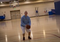 Airman 1st Class Nick Kolnitys, 5th Maintenance Squadron electrical and environmental apprentice, plays basketball after work on Minot Air Force Base, N.D., April 8, 2015. Kolnitys and his co-workers go to the gym after they get off their “swing” shift, which ends at 11 p.m. (U.S. Air Force photo/Airman 1st Class Apryl Hall)