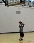 Senior Airman William Kelly, 5th Maintenance Squadron electrical and environmental apprentice plays basketball at the McAdoo Fitness Center after his swing shift on Minot Air Force Base, N.D., April 8, 2015. With the fitness center being open 24 hours a day, Airmen are able to go to the gym at any time of day or night. (U.S. Air Force photo/Senior Airman Kristoffer Kaubisch)
