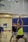 Members from the 5th Aircraft Maintenance Squadron and 791st Missile Security Forces Squadron play a game of volleyball on Minot Air Force Base, N.D., April 8, 2015. The McAdoo Fitness Center is open 24-hours for Airmen to remain fit, play sports or swim. (U.S. Air Force photo/Senior Airman Malia Jenkins)  