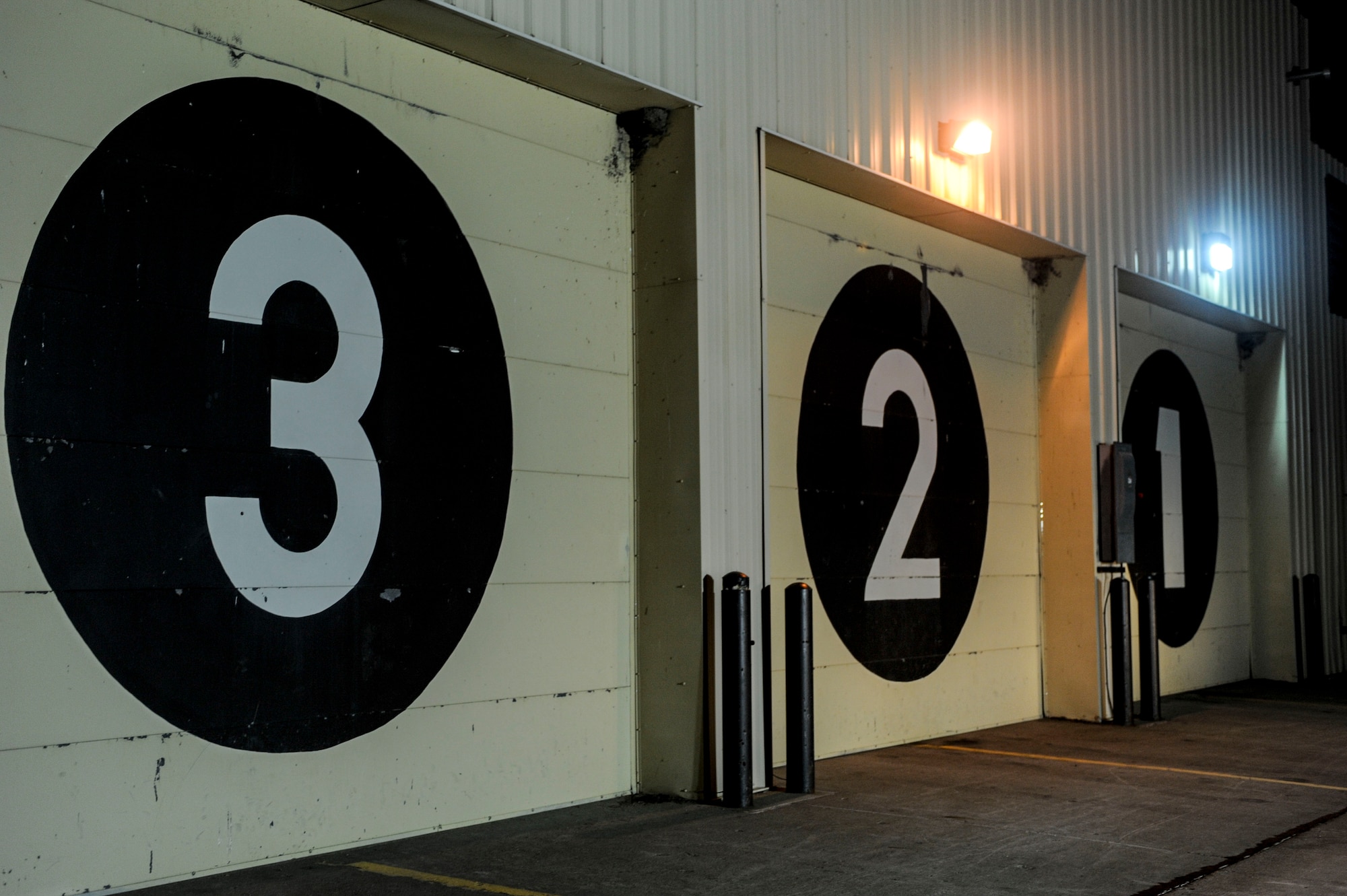 Area lights illuminate the front of a structure in the weapons storage area on Minot Air Force Base, N.D., April 4, 2015.  5th Security Forces Squadron Airmen are on constant alert, guarding structures and conducting patrols. (U.S. Air Force photo/Senior Airman Stephanie Morris)