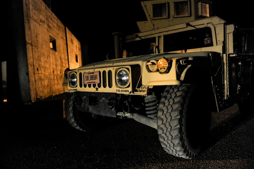 A Humvee patrols the weapons storage area during a recapture exercise on Minot Air Force Base, N.D., April 4, 2015. Alert fire teams are on constant patrol in the area, ready to respond to threats at a moment’s notice. (U.S. Air Force photo/Senior Airman Stephanie Morris)