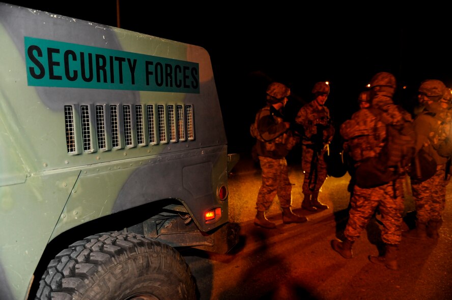 5th Security Forces Squadron Airmen rally together after a recapture exercise on Minot Air Force Base, N.D., April 4, 2015.  During the exercise, Airmen re-took a simulated enemy occupied structure. (U.S. Air Force photo/Senior Airman Stephanie Morris)