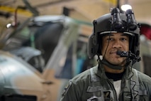Staff Sgt. Demario Greene, 54th Helicopter Squadron special mission aviator, poses in front of a UH-1N Huey on Minot Air Force Base, N.D., April 8, 2015. SMAs mission at Minot AFB is 24/7 Nuclear Security for not only the 791st Missile Security Forces Squadron convoy section but the missile field as well. (U.S. Air Force photo/Senior Airman Brittany Y. Bateman)