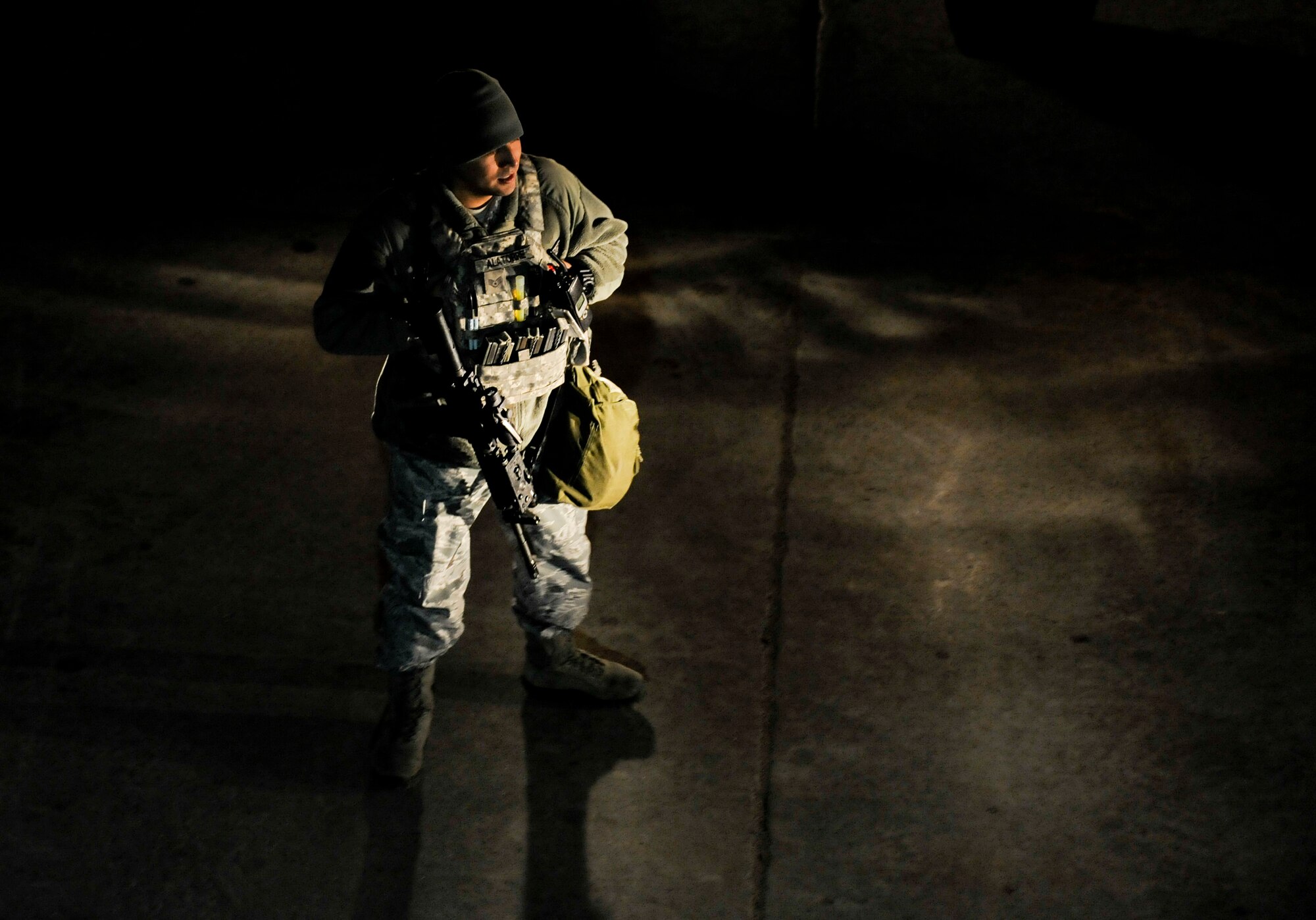 Staff Sgt. Ignacio Alatorre, 5th Security Forces Squadron security controller, observes a recapture exercise on Minot Air Force Base, N.D., April 4, 2015. As Whiskey 1, in the weapons storage area, Alatorre is responsible for overseeing operations of personnel and pointing out any equipment discrepancies such as faulty area lighting and conducting training exercises with his Airmen. (U.S. Air Force photo/Senior Airman Stephanie Morris)