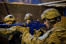 Members of the 91st Security Forces Group tactical response force practice building clearing techniques during training on Minot Air Force Base, N.D., April 8, 2015. TRF is a nuclear special weapons and tactics team specializing in recapture and recovery operations. (U.S. Air Force photo/Senior Airman Brittany Y. Bateman)