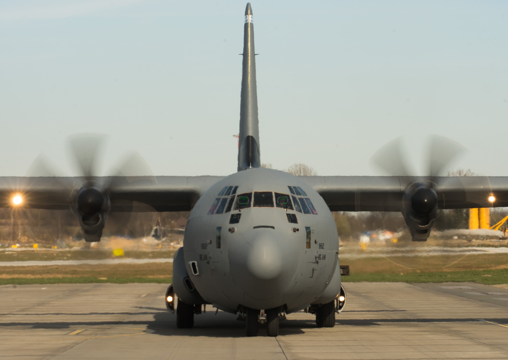 A C-130J Super Hercules assigned to the 37th Airlift Squadron taxis in to pick up Poland Air Force paratroopers at Krakow, Poland. Pilots from the 37th Airlift Squadron trained alongside their Polish counterparts in nighttime low level, unimproved landing zone, dropping Polish air force paratroopers and more. (U.S. Air Force photo/Senior Airman Jonathan Stefanko)