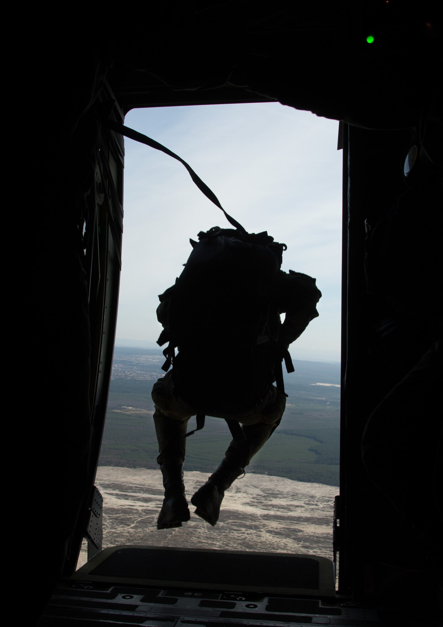 Poland air force paratroopers jump from a C-130J Super Hercules assigned to the 37th Airlift Squadron during training above Krakow, Poland. Polish Armed Forces trained alongside U.S. military members during a flying training deployment to Powidz, poland. The goal of the deployment was to build and improve partnership with the Polish air Force as well as interoperability for future operations. (U.S. Air Force photo/Senior Airman Jonathan Stefanko)