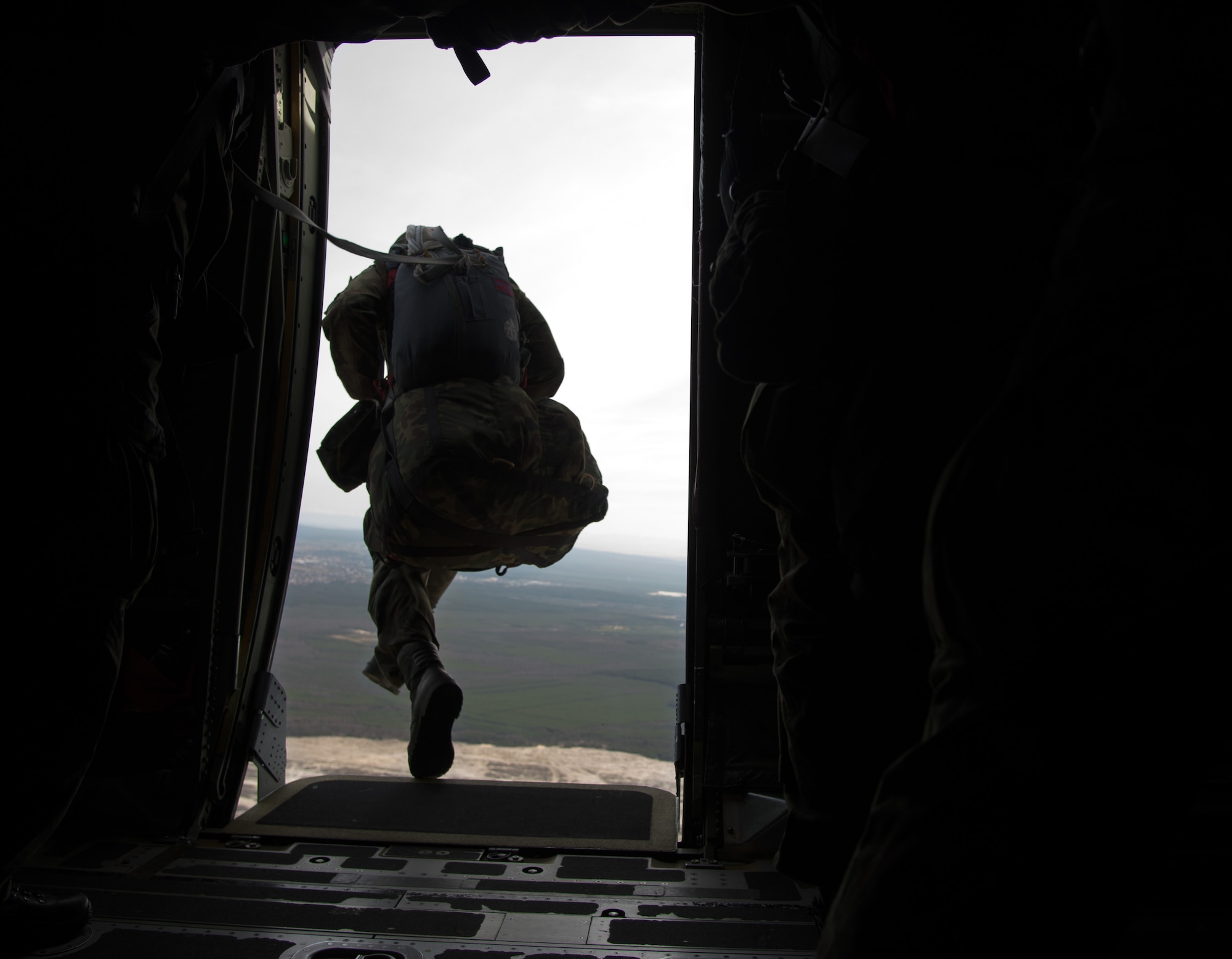Poland air force paratroopers jump from a C-130J Super Hercules assigned to the 37th Airlift Squadron during training above Krakow, Poland. Polish Armed Forces trained alongside U.S. military members during a flying training deployment to Powidz, poland. The goal of the deployment was to build and improve partnership with the Polish air Force as well as interoperability for future operations. (U.S. Air Force photo/Senior Airman Jonathan Stefanko)