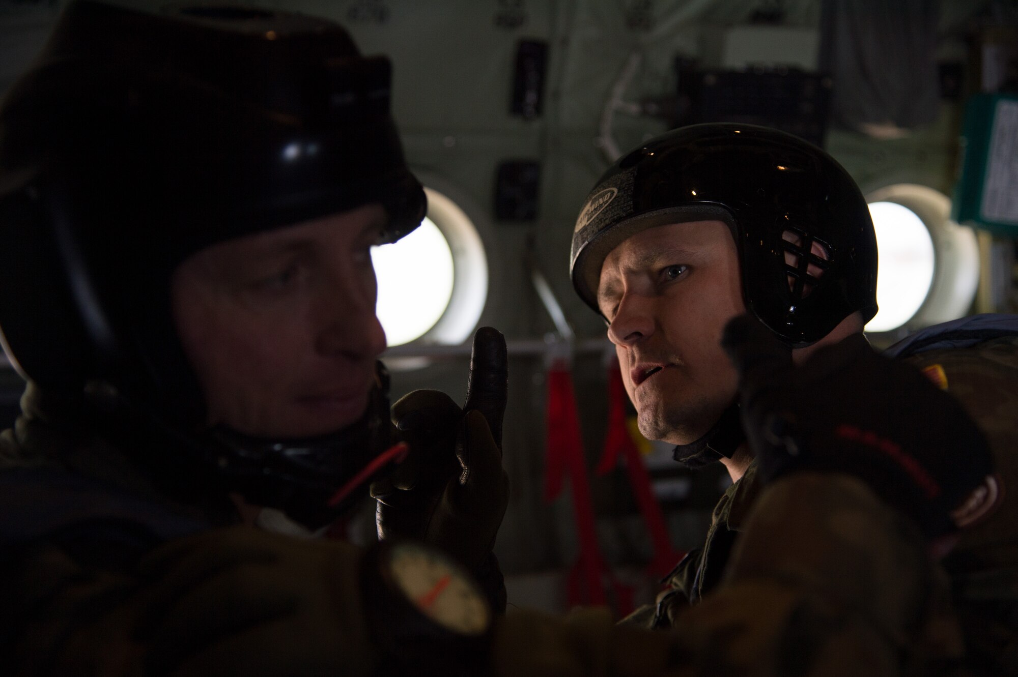 Poland air force paratroopers ensure their equipment is fitted correctly before they jump from a C-130J Super Hercules assigned to the 37th Airlift Squadron during training above Krakow, Poland. Polish Armed Forces trained alongside U.S. military members during a flying training deployment to Powidz, Poland. The goal of the deployment was to build and improve partnership with the Polish air force as well as interoperability for future operations. The training started on April 8 and will conclude April 17. (U.S. Air Force photo/Senior Airman Jonathan Stefanko)