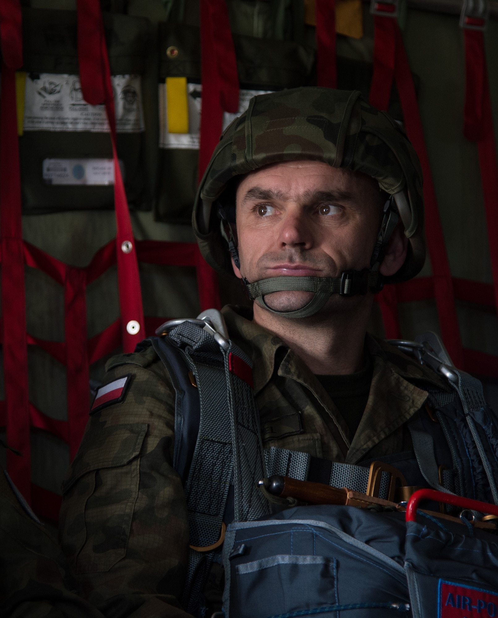 A Poland air force paratrooper waits to jump from a C-130J Super Hercules assigned to the 37th Airlift Squadron during training above Krakow, Poland. Polish Armed Forces trained alongside U.S. military members during a flying training deployment to Powidz, Poland. The goal of the deployment was to build and improve partnership with the Polish air force as well as interoperability for future operations. (U.S. Air Force photo/Senior Airman Jonathan Stefanko)