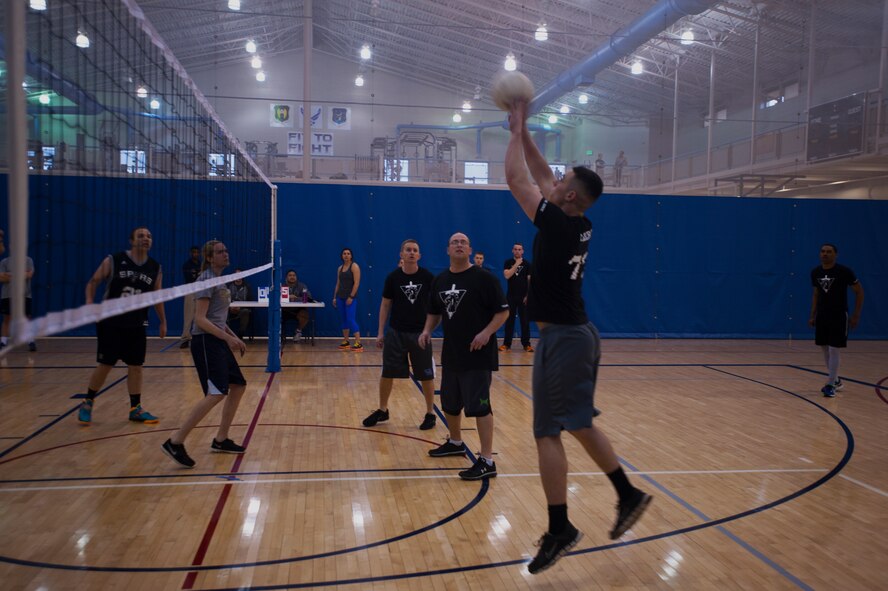 A member of the 791st Missile Security Forces Squadron returns a serve during a game of volleyball on Minot Air Force Base, N.D., April 8, 2015. The McAdoo Fitness Center offers many activities for all personnel on Minot AFB. (U.S. Air Force photo/Airman 1st Class Christian Sullivan)