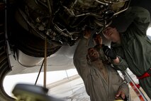 Aerospace propulsion journeymen from the 5th Aircraft Maintenance Squadron change the starter on a B-52H Stratofortress engine on Minot Air Force Base, N.D., April 8, 2015. Airmen from the propulsion flight ensure B-52H engines are in first-rate operational condition, which ensures the engines are fully capable to carry out any task a pilot may have is what the propulsion flight does every day. (U.S. Air Force photo/Senior Airman Brittany Y. Bateman)