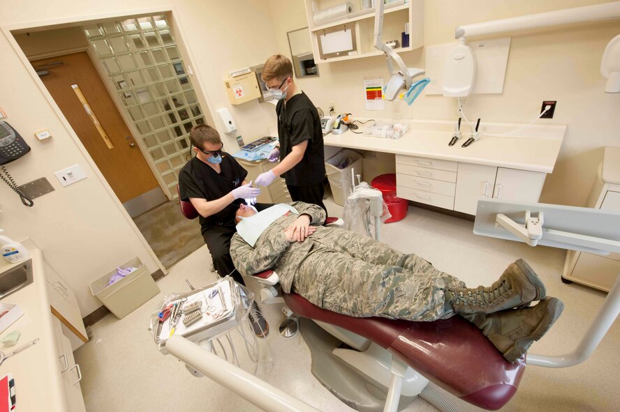 Capt. Andrew Thomasson, 5th Medical Operations Squadron dentist, makes an Impression of a patient’s teeth on Minot Air Force Base, N.D., April 8, 2015. After an impression is taken the dental clinic is able to make custom dental prosthetics based on the patient’s needs. (U.S. Air Force photo/Airman 1st Class Sahara L. Fales)