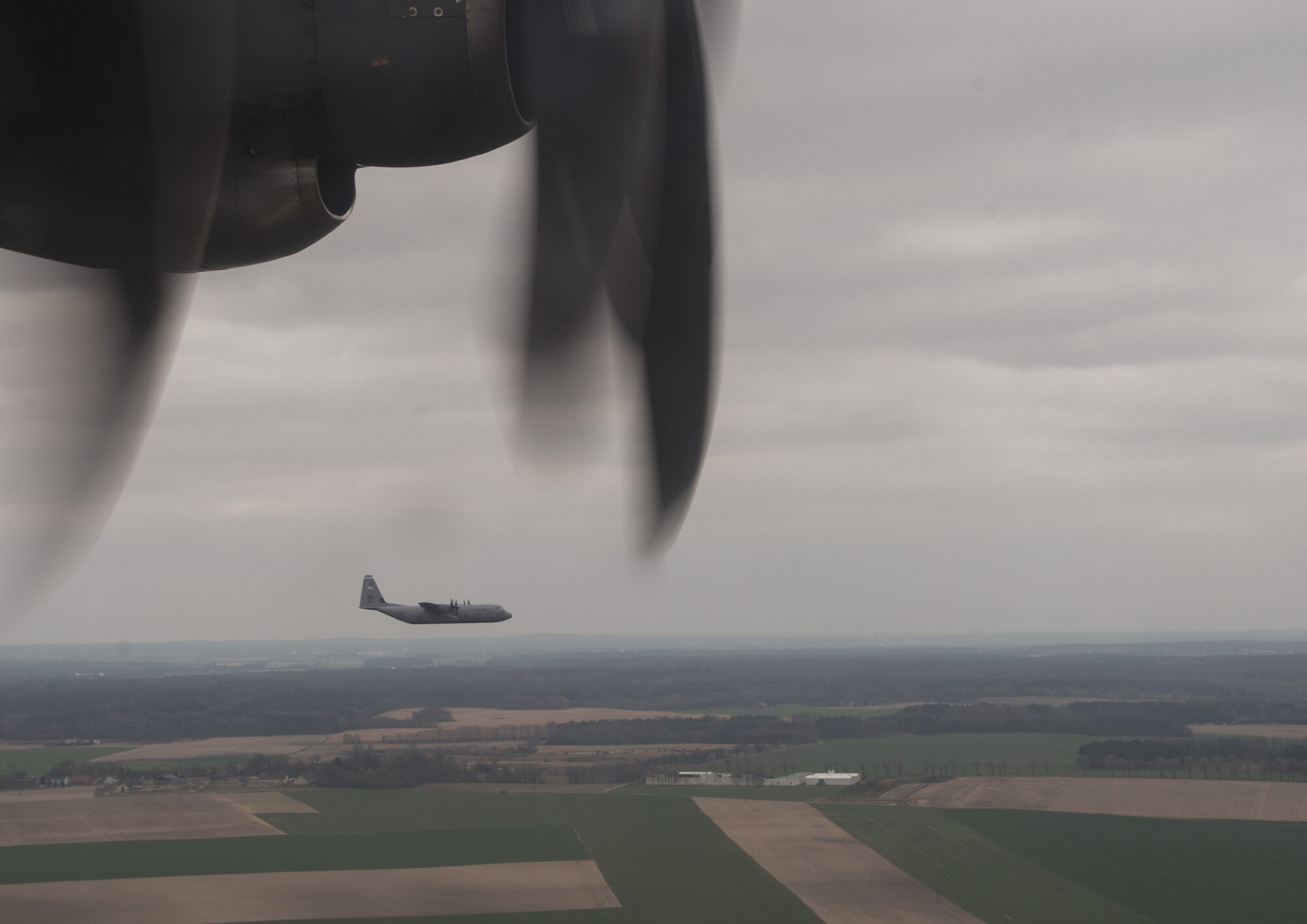 A C-130J Super Hercules from Ramstein Air Base, Germany flies above Poland during a flying training deployment April 8, 2015. Active duty and reserve service members arrived to Powidz, Poland to train with their Polish counterparts. (U.S. Air Force photo/Senior Airman Jonathan Stefanko)
