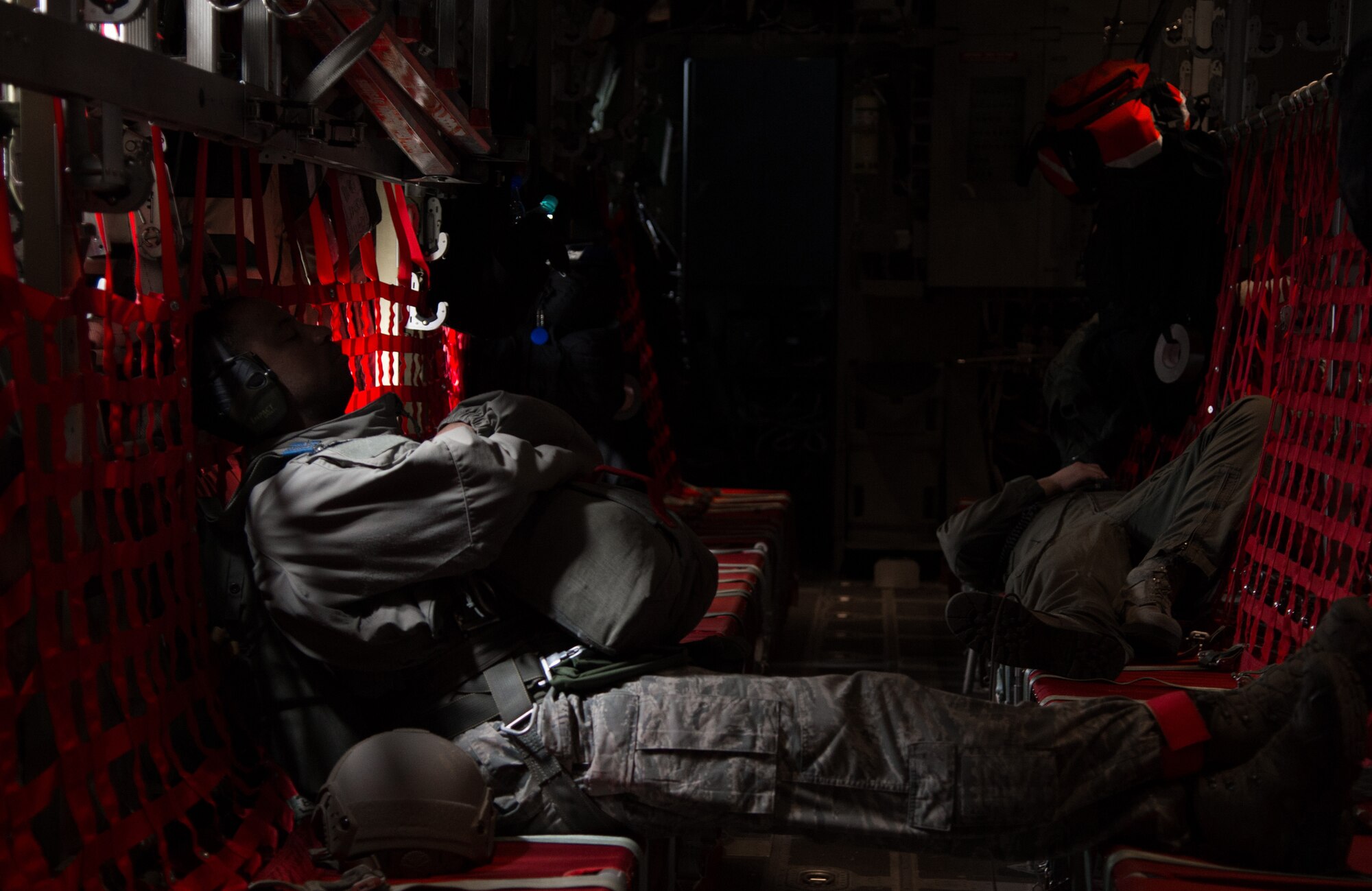 Airmen rest on a C-130J Super Hercules during a flying training deployment April 8, 2015 above Powidz Air Base, Poland. Armed Forces from Ramstein Air Base, Germany arrived in Poland during an aircraft rotation to train with Polish counterparts. (U.S. Air Force photo/Senior Airman Jonathan Stefanko)