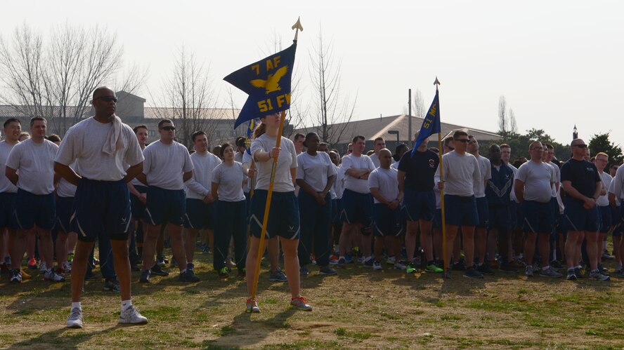 Members of Team Osan listen to Col. Brook Leonard, 51st Fighter Wing commander, speak before the start of the 51 days of resiliency run April 10, 2015, at Osan Air Base, Republic of Korea. Team Osan kicked off their 51 Days of Resiliency campaign with a mandatory installation-wide formation followed by a fun run and family festivities. (U.S. Air Force photo by Staff Sgt. Benjamin Sutton/Released)