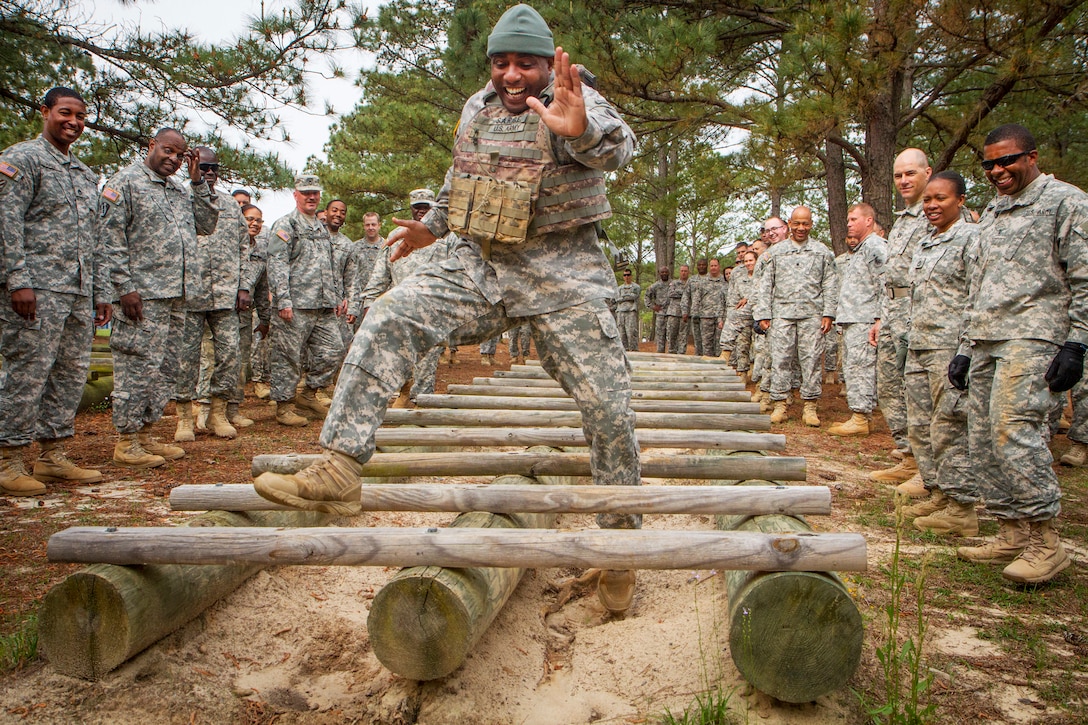 Army Reserve Sgt. 1st Class Robert Isom demonstrates how to highstep