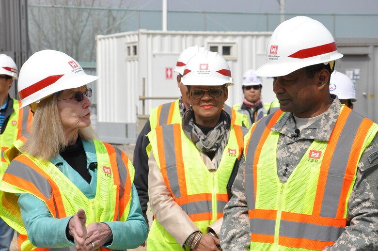 Lt. Gen. Thomas P. Bostick, commanding general of the U.S. Army Corps of Engineers (USACE) and 53rd Chief of Engineers, chats with Dr. Judith Allen, Department of Defense Education Activity Korea District superintendent (far left) about the millennial school construction project at Osan Air Base April 8, 2015. The school will be the first one in Korea with a 21st Century design. 
