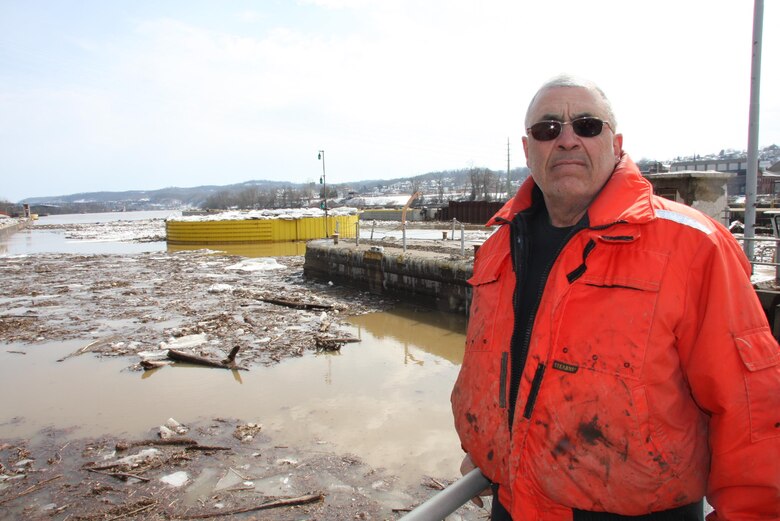 Lockmaster Paul Meininger stood against a backdrop of mud, ice and debris scattered across Monongahela River Locks and Dam 4 at Charleroi, March 7. 