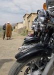 Members of the Kentucky National Guard Agribusiness Development Team with Provincial Reconstruction Team Panjshir delivered four brand-new Corola motorcycles to the Panjshir Province National Environmental Protection Agency director  on Aug. 17, 2010. Now, the director says the agency can enforce standards and do the government’s work.