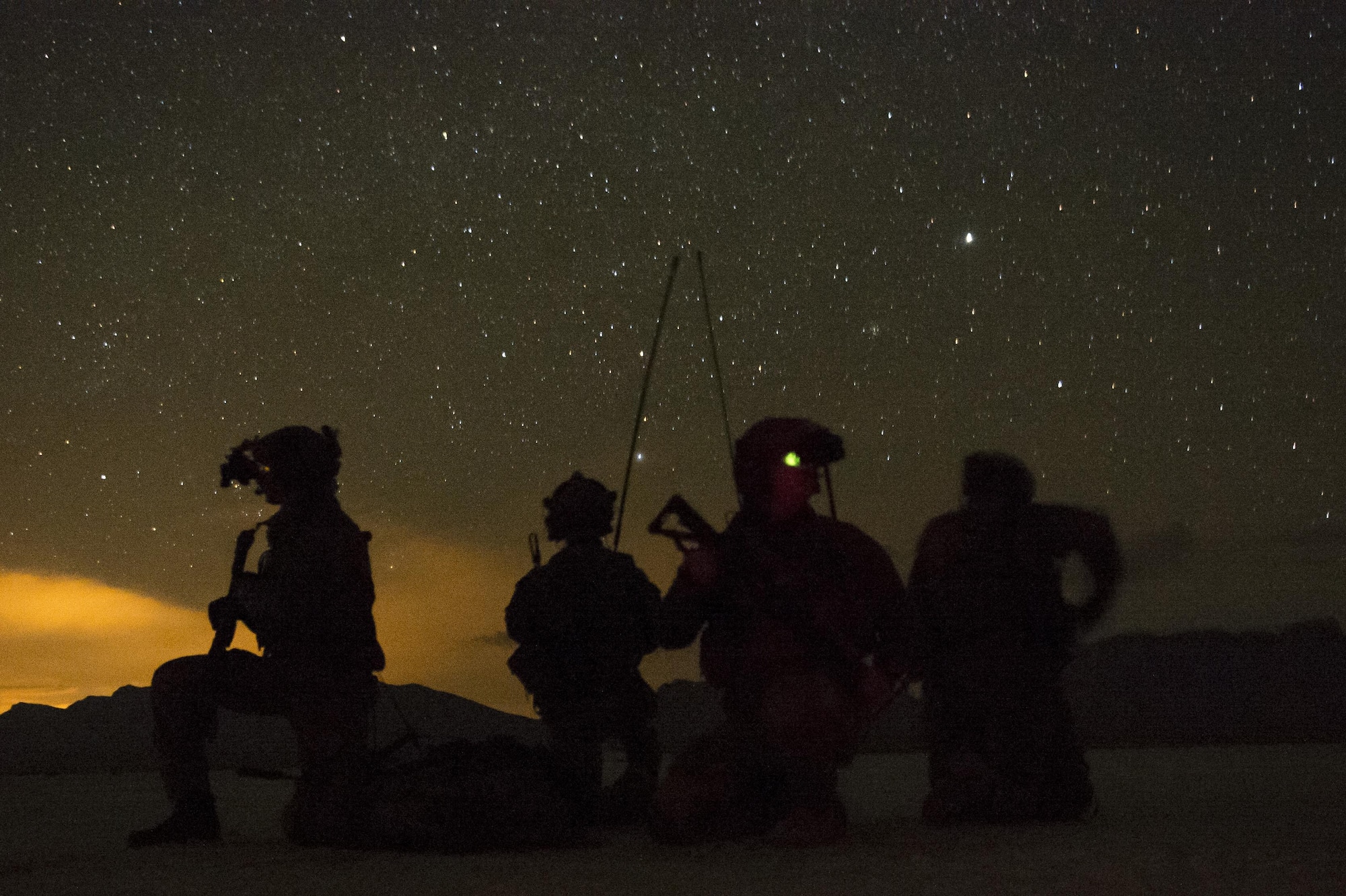 U.S. Air Force Special Tactics combat controllers establish security while setting up a landing strip in an austere environment during an exercise at an undisclosed location. Combat controllers are the Air Force’s ground special operations forces who integrate air and ground to provide intelligence, precision strikes, assault zones, drop zones and air traffic control in hostile and austere environments.