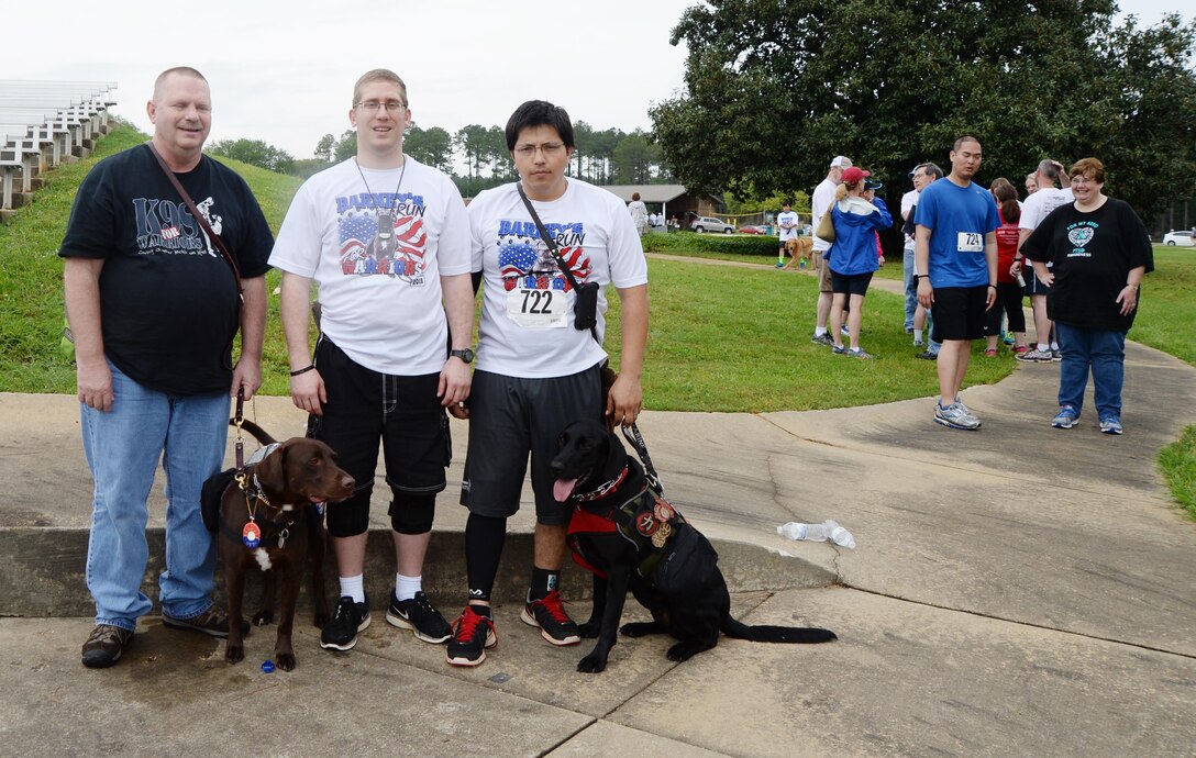 Benefactors of the Barney’s Run, Larry Barfield (left) received Camo in 2013, Jorge Torres (right) received Ruey in 2014 and Mark Mosley (center) is scheduled to receive a dog later this year.
