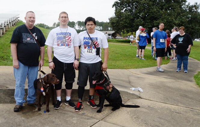 Benefactors of the Barney’s Run, Larry Barfield (left) received Camo in 2013, Jorge Torres (right) received Ruey in 2014 and Mark Mosley (center) is scheduled to receive a dog later this year.