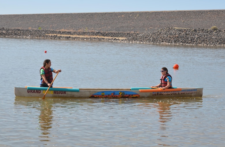 COCHITI LAKE, N.M. -- NMSU team members practice maneuvering their concrete canoe, April 11, 2015. NMSU placed first at the 44th annual American Society of Civil Engineers Rocky Mountain Regional Conference. 