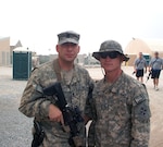 Army Sgt. 1st Class Marc Seal, left, stands with his son, Army Pfc. Nolan Seal, at Kandahar Airfield, Afghanistan, Aug. 9, 2010.