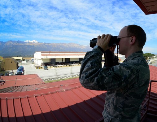 Senior Airman Aaron Antwine, a 31st Operations Support Squadron weather forecaster, checks visibility, April 8, 2015, at Aviano Air Base, Italy. Aviano’s weather forecasters provide staff support to 31st Fighter Wing pilots, commanders and decision makers for 24/7 base resource protection along with airfield and mission services. (U.S. Air Force photo/Senior Airman Areca T. Wilson)